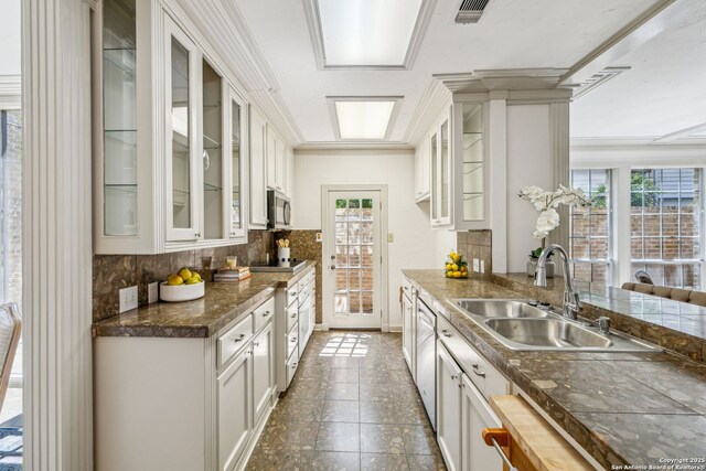 209 Chichester Pl Unit 1, San Antonio, TX 78209 - kitchen with a sink, backsplash, appliances with stainless steel finishes, and white cabinets