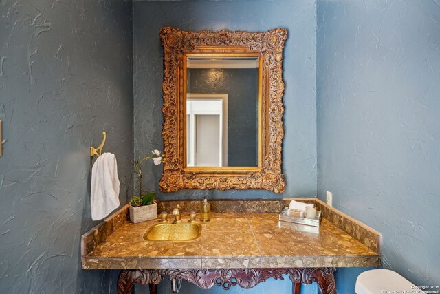 209 Chichester Pl Unit 1, San Antonio, TX 78209 - half bathroom featuring a sink and toilet
