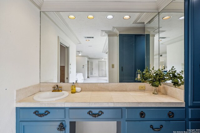 209 Chichester Pl Unit 1, San Antonio, TX 78209 - bathroom with crown molding, vanity, and recessed lighting