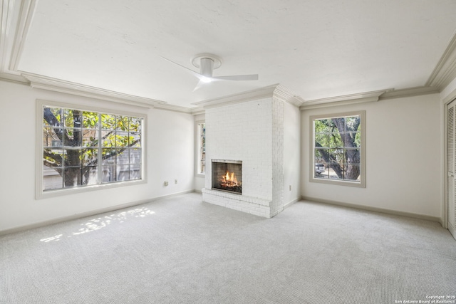 209 Chichester Pl Unit 1, San Antonio, TX 78209 - unfurnished living room featuring ornamental molding, carpet floors, a fireplace, ceiling fan, and baseboards