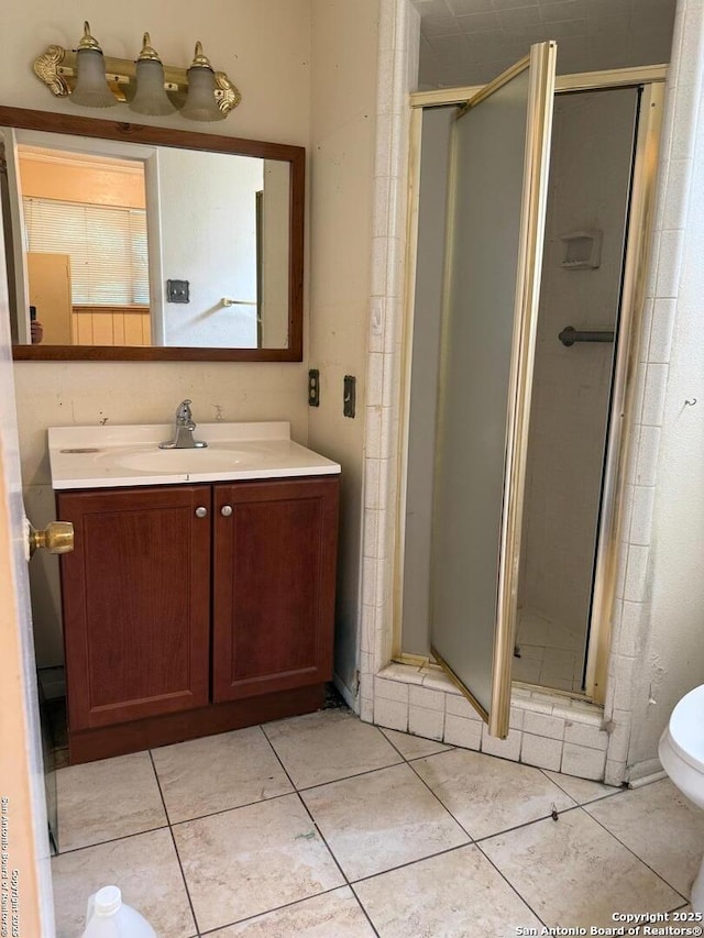 254 W Greenway Ave, San Antonio, TX 78226 - full bath featuring vanity, a stall shower, tile patterned floors, and toilet