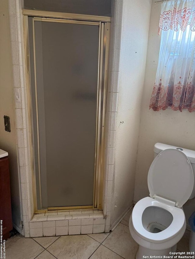 254 W Greenway Ave, San Antonio, TX 78226 - full bath with a stall shower, toilet, and tile patterned floors