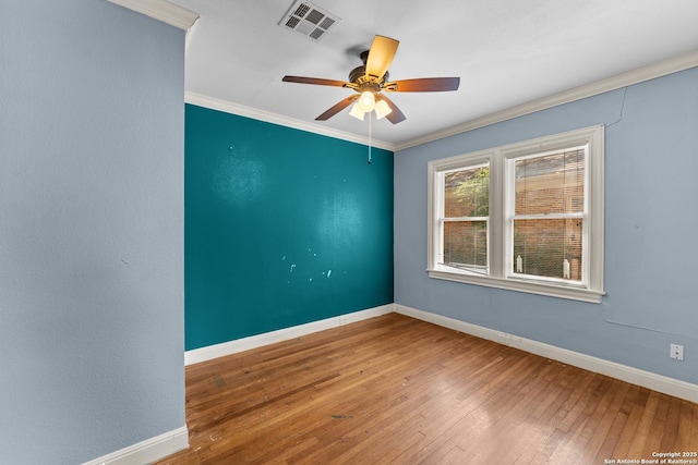 427 Donaldson, San Antonio, TX 78201 - empty room with hardwood / wood-style floors, baseboards, ceiling fan, and ornamental molding