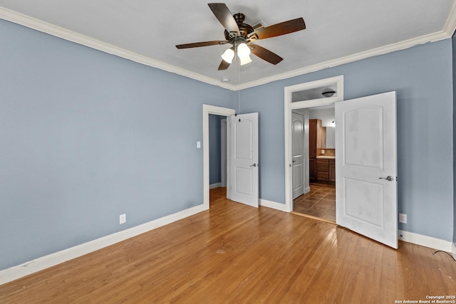 427 Donaldson, San Antonio, TX 78201 - unfurnished bedroom with ornamental molding, baseboards, light wood-type flooring, and a ceiling fan