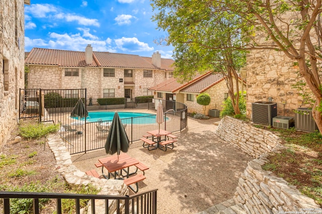 7738 Chambers Unit 612, San Antonio, TX 78229 - view of swimming pool with cooling unit and a patio area