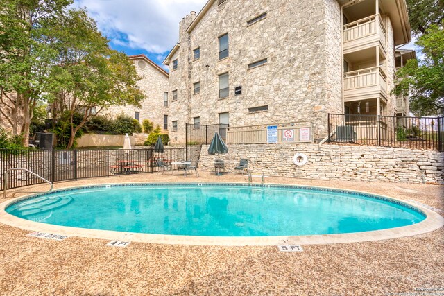 7738 Chambers Unit 612, San Antonio, TX 78229 - community pool featuring central AC unit