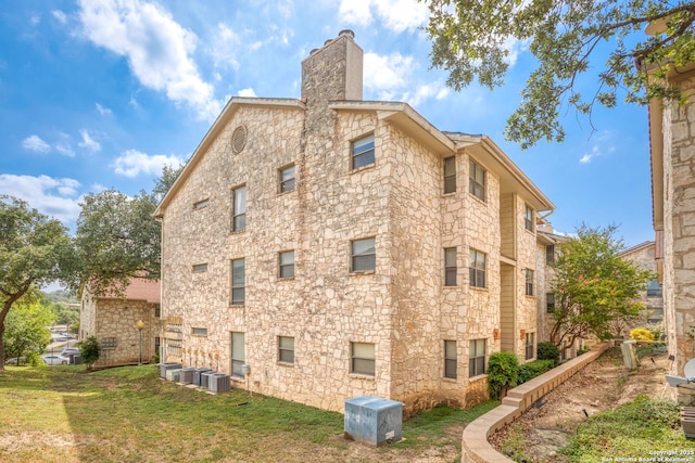 7738 Chambers Unit 612, San Antonio, TX 78229 - view of building exterior featuring central AC