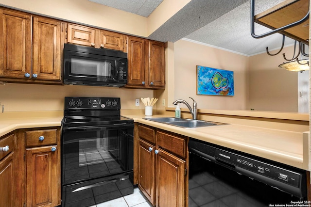 7738 Chambers Unit 612, San Antonio, TX 78229 - kitchen with black appliances, a sink, light tile patterned floors, a textured ceiling, and light countertops