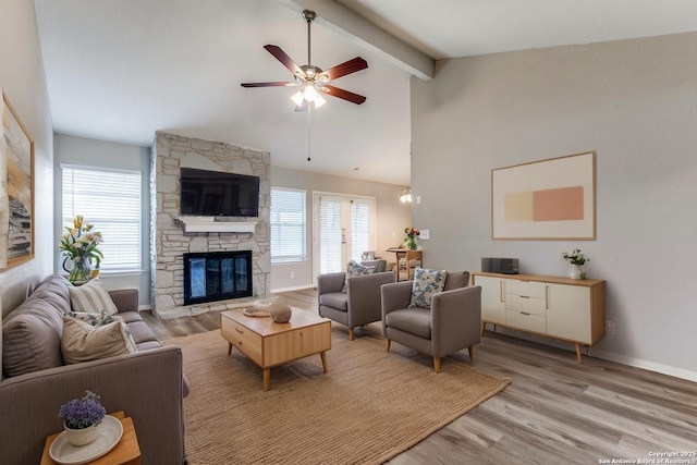 1111 Rio Linda, San Antonio, TX 78245 - living area with light wood-type flooring, beam ceiling, healthy amount of natural light, ceiling fan, and a fireplace