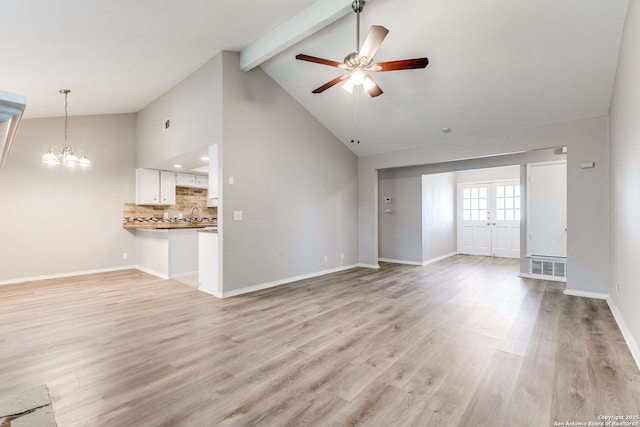 1111 Rio Linda, San Antonio, TX 78245 - unfurnished living room with a ceiling fan, beamed ceiling, high vaulted ceiling, light wood finished floors, and baseboards