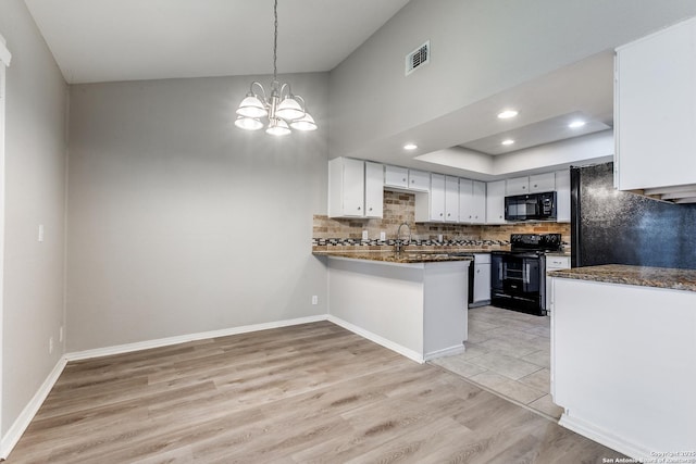 1111 Rio Linda, San Antonio, TX 78245 - kitchen with black appliances, dark countertops, a peninsula, tasteful backsplash, and white cabinets