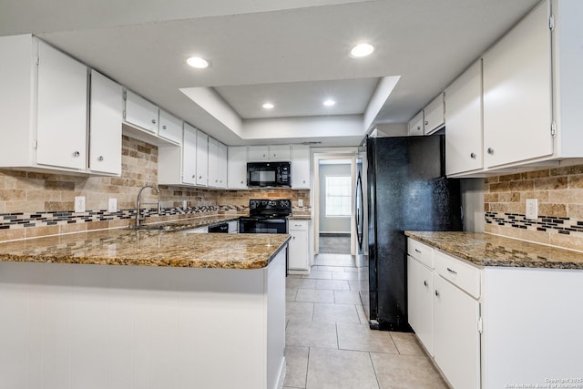 1111 Rio Linda, San Antonio, TX 78245 - kitchen featuring black appliances, a peninsula, white cabinets, decorative backsplash, and recessed lighting