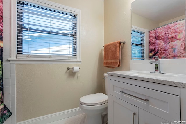 322 Pool, San Antonio, TX 78223 - bathroom featuring vanity, toilet, and baseboards