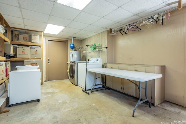 322 Pool, San Antonio, TX 78223 - below grade area with washing machine and clothes dryer, a paneled ceiling, and water heater