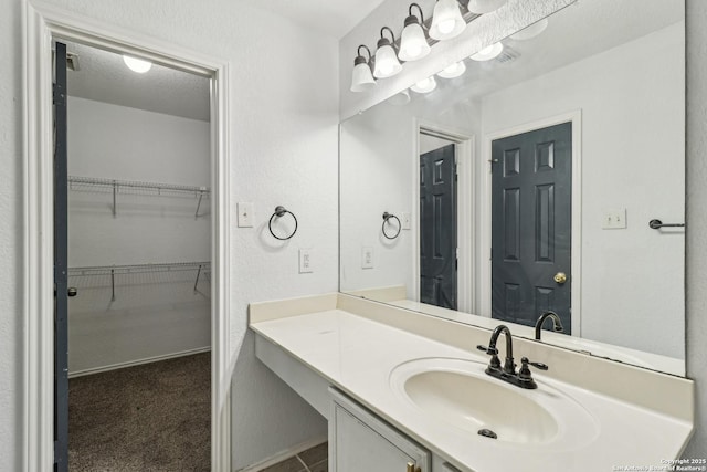 87 Kenrock Rdg, San Antonio, TX 78254 - bathroom featuring vanity and a walk in closet