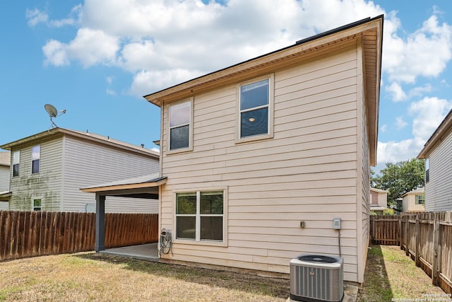 87 Kenrock Rdg, San Antonio, TX 78254 - back of house with cooling unit and a patio