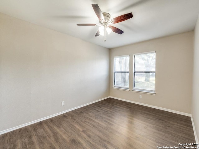 7363 Longing Trl, San Antonio, TX 78244 - empty room with dark wood-style flooring, baseboards, and ceiling fan