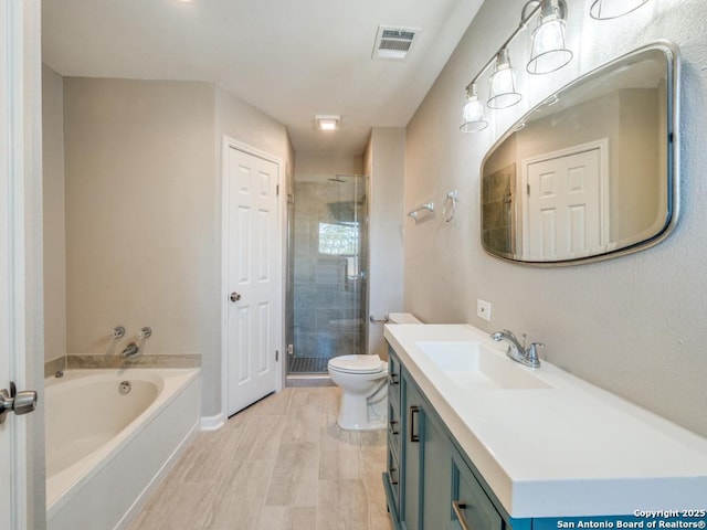 7363 Longing Trl, San Antonio, TX 78244 - bathroom with vanity, a stall shower, a garden tub, toilet, and baseboards
