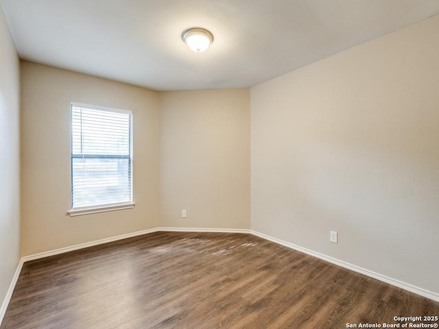 7363 Longing Trl, San Antonio, TX 78244 - unfurnished room with dark wood-style floors and baseboards