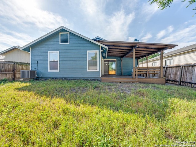 7363 Longing Trl, San Antonio, TX 78244 - rear view of property with a fenced backyard, central air condition unit, and a wooden deck