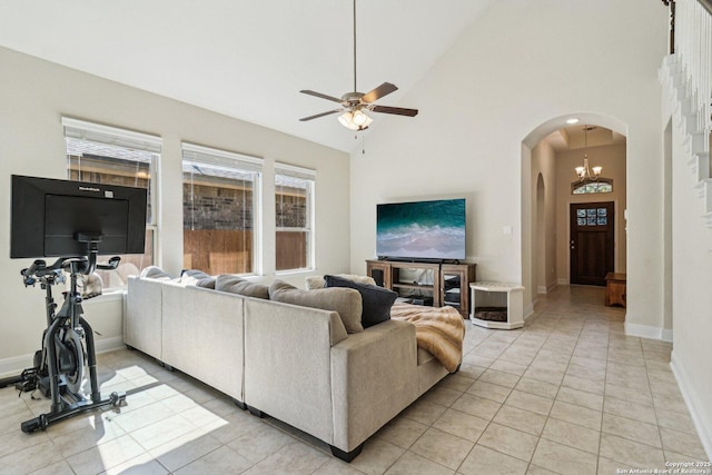 9010 La Junta, San Antonio, TX 78254 - living room with arched walkways, a ceiling fan, high vaulted ceiling, and baseboards