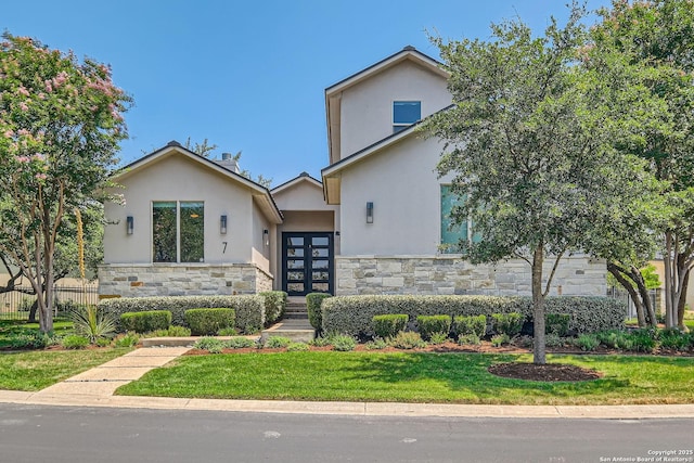 7 Saxby Gln, San Antonio, TX 78257 - view of front of house with stone siding, stucco siding, and french doors