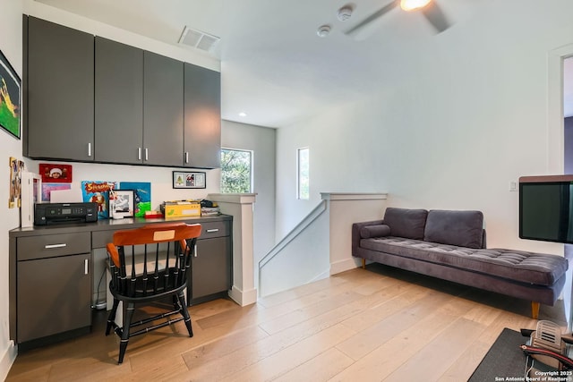7 Saxby Gln, San Antonio, TX 78257 - kitchen with dark countertops, light wood-style floors, a ceiling fan, open floor plan, and recessed lighting