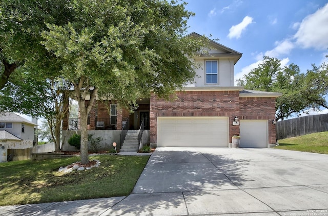 12535 Panola Way, San Antonio, TX 78253 - obstructed view of property featuring brick siding, a garage, driveway, and stucco siding