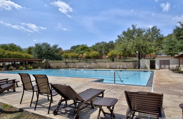 12535 Panola Way, San Antonio, TX 78253 - community pool with a patio and a pergola
