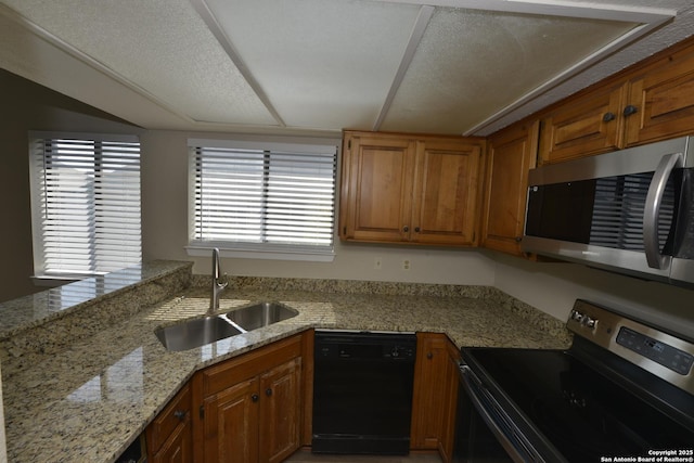 12610 Uhr Ln Unit 281, San Antonio, TX 78217 - kitchen featuring appliances with stainless steel finishes, a sink, and brown cabinets