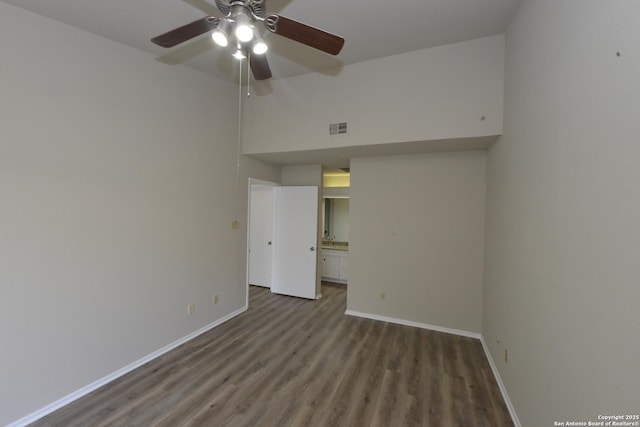 12610 Uhr Ln Unit 281, San Antonio, TX 78217 - unfurnished bedroom featuring wood finished floors, baseboards, ensuite bathroom, a high ceiling, and a ceiling fan