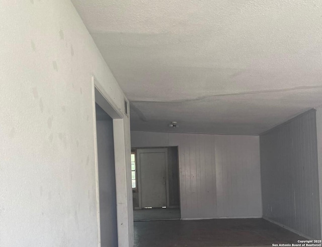 1743 Athel Ave, San Antonio, TX 78237 - hall with a textured ceiling and wooden walls
