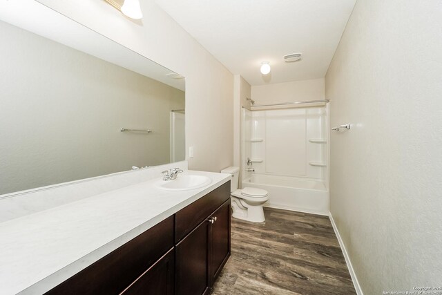 202 Reuben Kemper, San Antonio, TX 78220 - bathroom featuring vanity, wood finished floors, toilet, bathing tub / shower combination, and baseboards