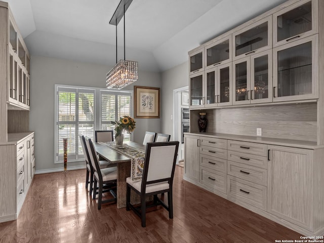 16 Cheshire, San Antonio, TX 78218 - dining area featuring vaulted ceiling, dark wood-style floors, a chandelier, and baseboards