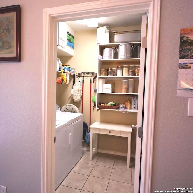 12115 Redbud Leaf, San Antonio, TX 78253 - laundry room with light tile patterned floors and a textured wall