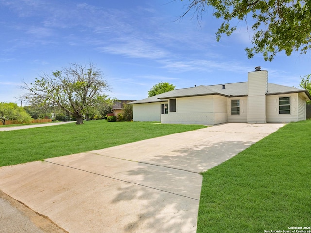 1005 N N, Universal City, TX 78148 - view of front of property with a front yard, concrete driveway, and a chimney