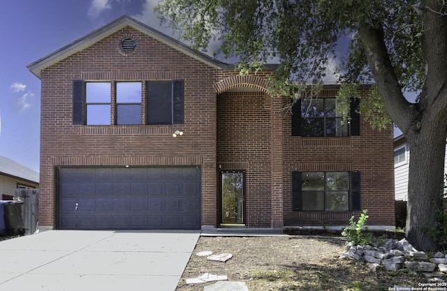 10322 Fork Crk, San Antonio, TX 78245 - view of front of home with an attached garage, brick siding, and concrete driveway