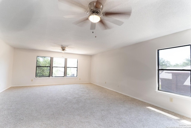 10322 Fork Crk, San Antonio, TX 78245 - carpeted spare room featuring baseboards and a ceiling fan