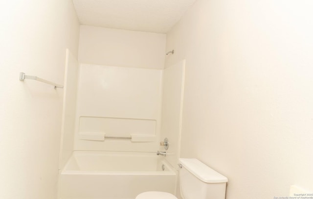 10322 Fork Crk, San Antonio, TX 78245 - full bathroom with toilet,  shower combination, and a textured ceiling