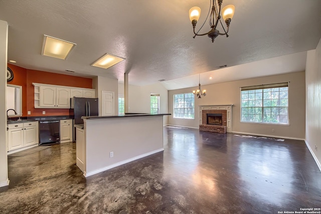 1510 Kingsbridge, San Antonio, TX 78253 - kitchen featuring black dishwasher, a chandelier, dark countertops, white cabinetry, and a fireplace