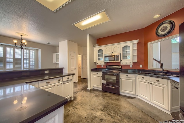 1510 Kingsbridge, San Antonio, TX 78253 - kitchen with black range with electric cooktop, stainless steel microwave, a sink, concrete floors, and dark countertops