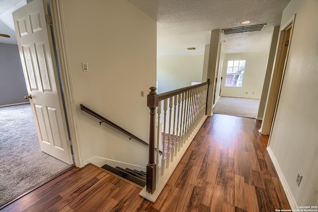 1510 Kingsbridge, San Antonio, TX 78253 - corridor with an upstairs landing, wood finished floors, baseboards, carpet, and a textured ceiling