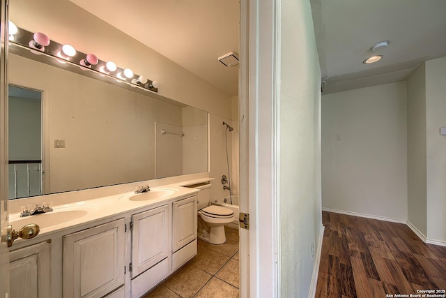 1510 Kingsbridge, San Antonio, TX 78253 - bathroom featuring toilet, double vanity, washtub / shower combination, and tile patterned floors