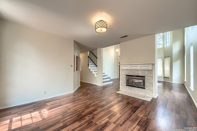 1510 Kingsbridge, San Antonio, TX 78253 - unfurnished living room with stairs, dark wood-style floors, a fireplace, and baseboards