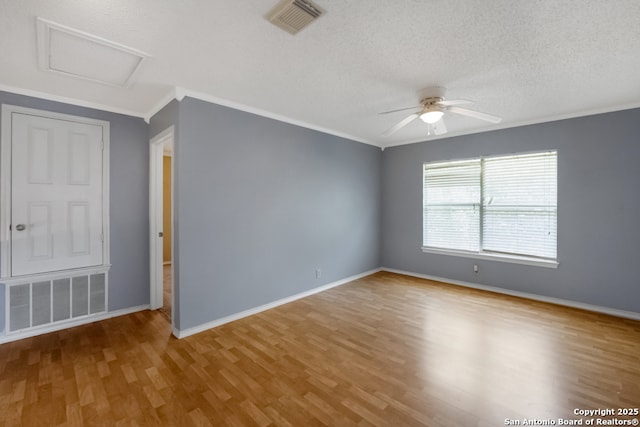 9503 Marshall Pt, San Antonio, TX 78240 - unfurnished room with wood finished floors, ceiling fan, attic access, baseboards, and ornamental molding
