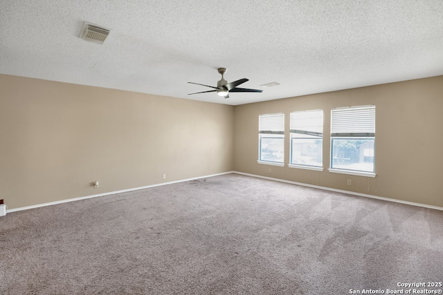 9503 Marshall Pt, San Antonio, TX 78240 - carpeted empty room featuring ceiling fan, a textured ceiling, and baseboards