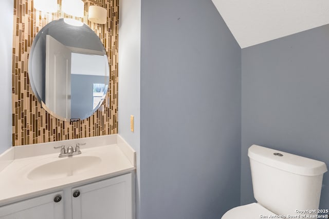9503 Marshall Pt, San Antonio, TX 78240 - bathroom with toilet, vanity, and vaulted ceiling