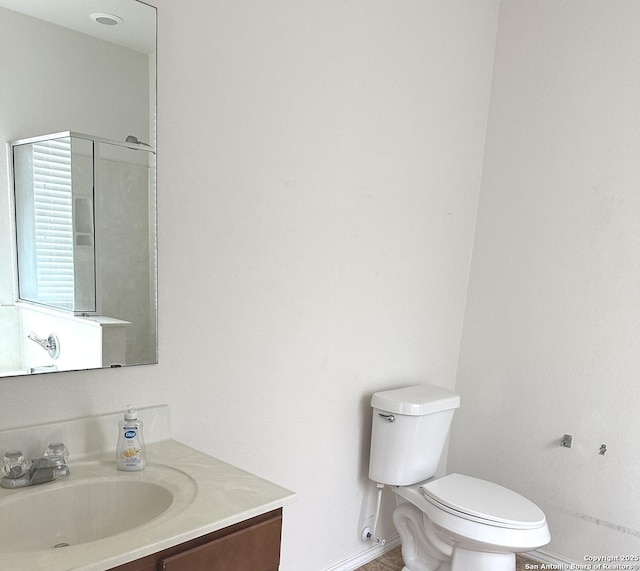 16210 Raceway Downs, Selma, TX 78154 - bathroom featuring baseboards, toilet, vanity, and a shower