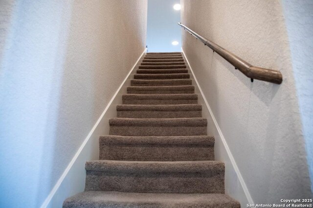 251 Burning Star Blvd, Castroville, TX 78009 - stairs with a textured wall