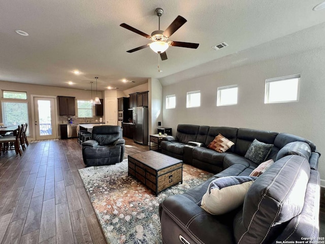 251 Burning Star Blvd, Castroville, TX 78009 - living room with ceiling fan, hardwood / wood-style floors, healthy amount of natural light, and a textured ceiling